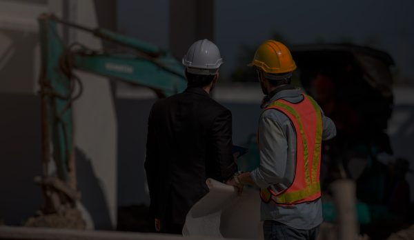 Construction worker and engineer working together on construction site. Construction worker and engineer working together on construction site.